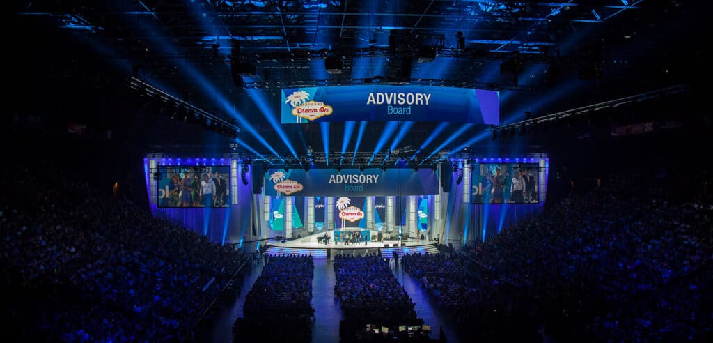 Plexus corporate event stage presenter with professional lighting