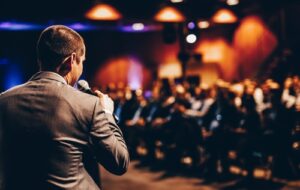 Speaker giving a talk on corporate business conference