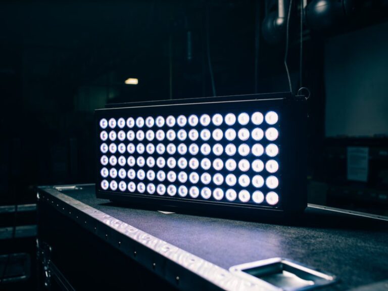 Stage lighting equipment with multiple LEDs in a dim setting.