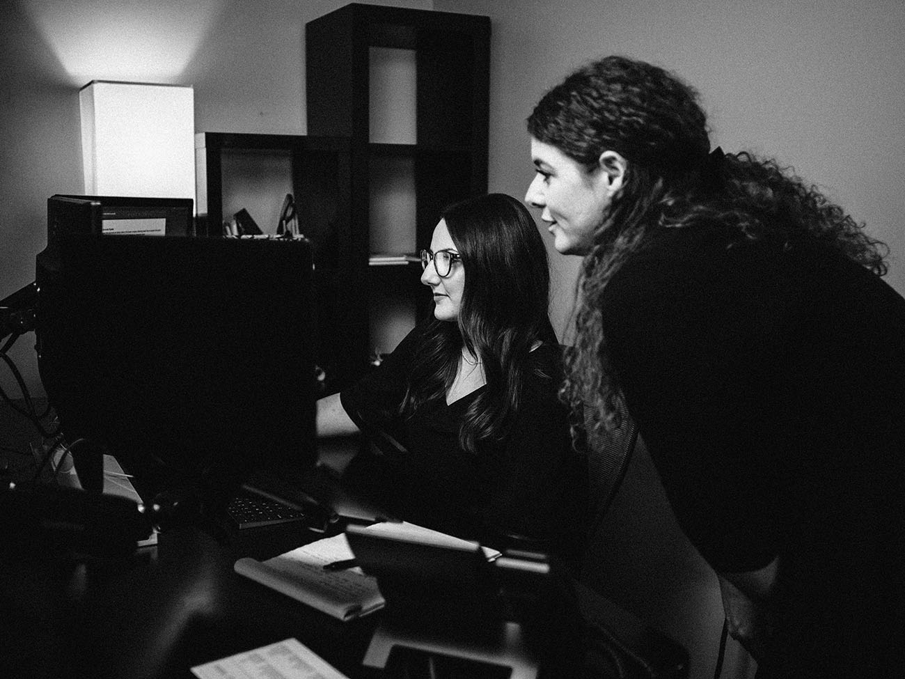 Elite employees work on computer for Elite project planning