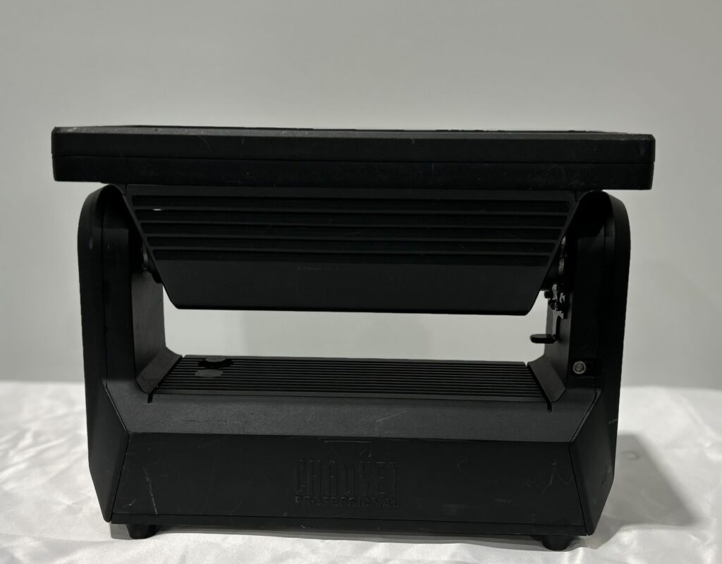 Stage spotlight on a table, used in event lighting setup.